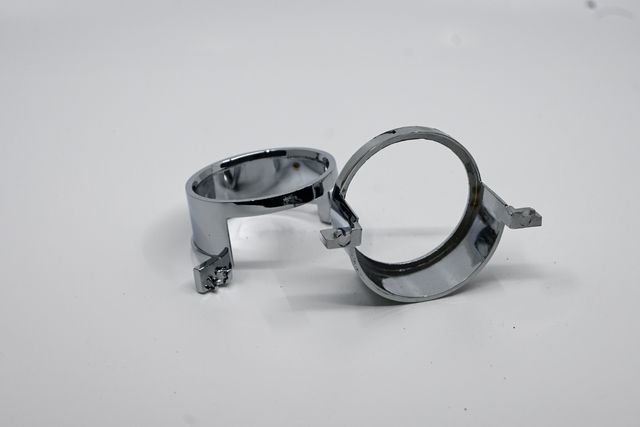 Two chrome trim rings photographed in the lightbox